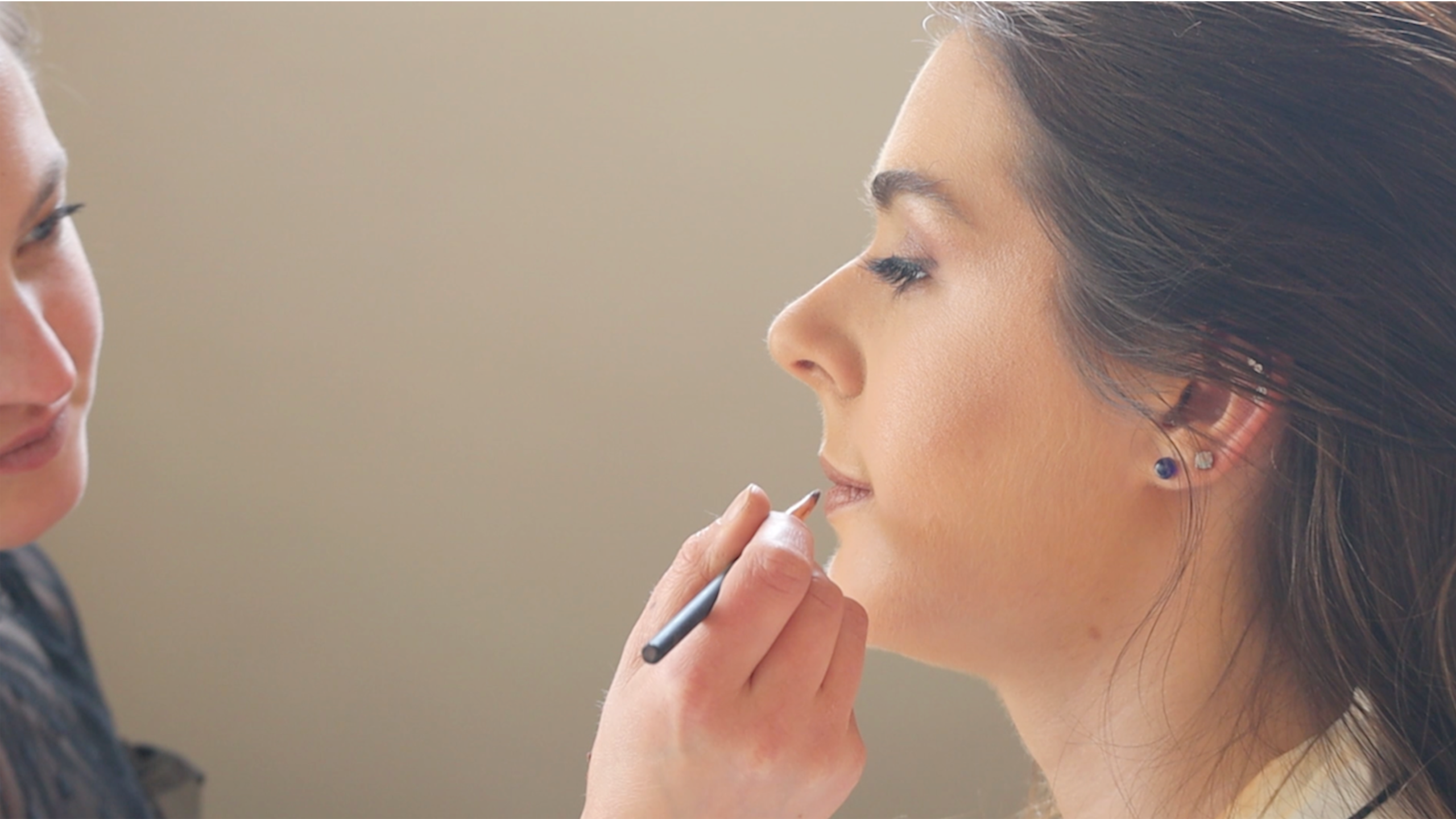 Woman having her wedding make up being applied